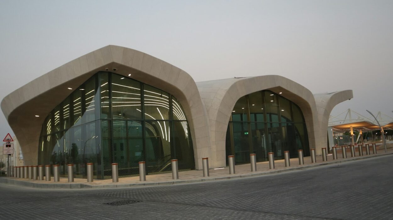 Doha Metro station with a curved white roof and glass front in Qatar