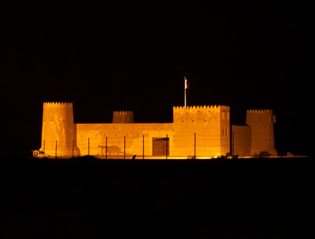 Al Zubarah Fort lit up at night