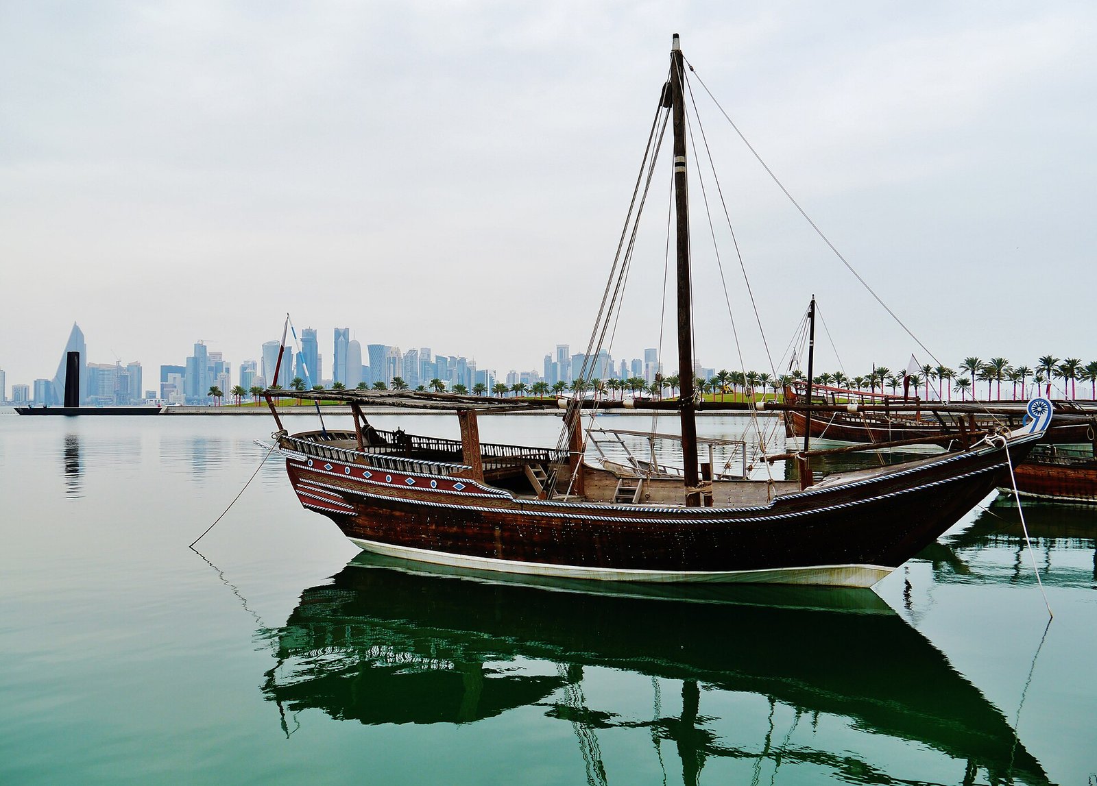 A traditional dhow moored off MIA Park