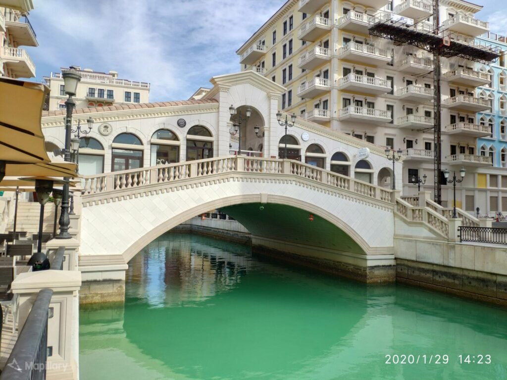 A footbridge over a canal in Qanat Quartier