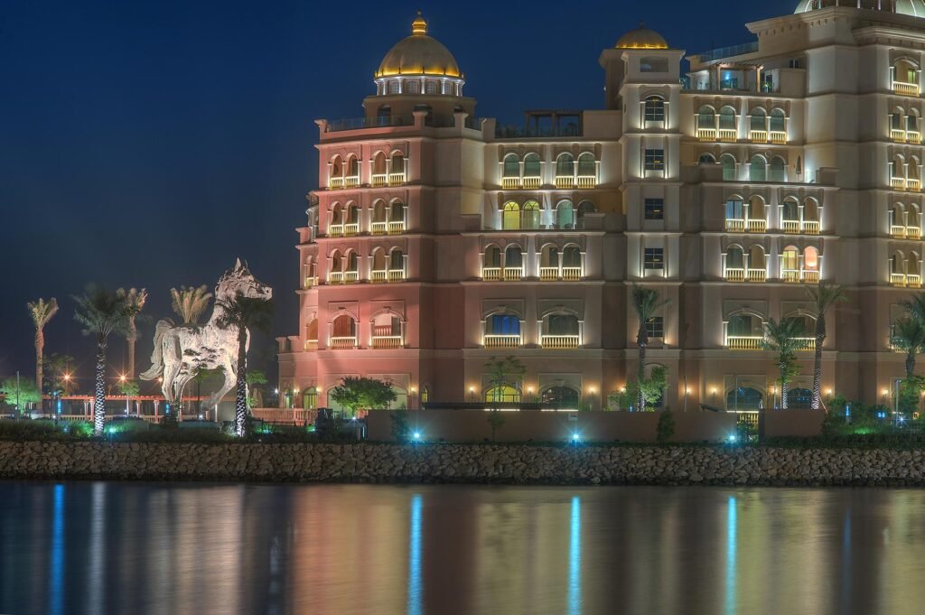 The Marsa Malaz Kempinski hotel at night